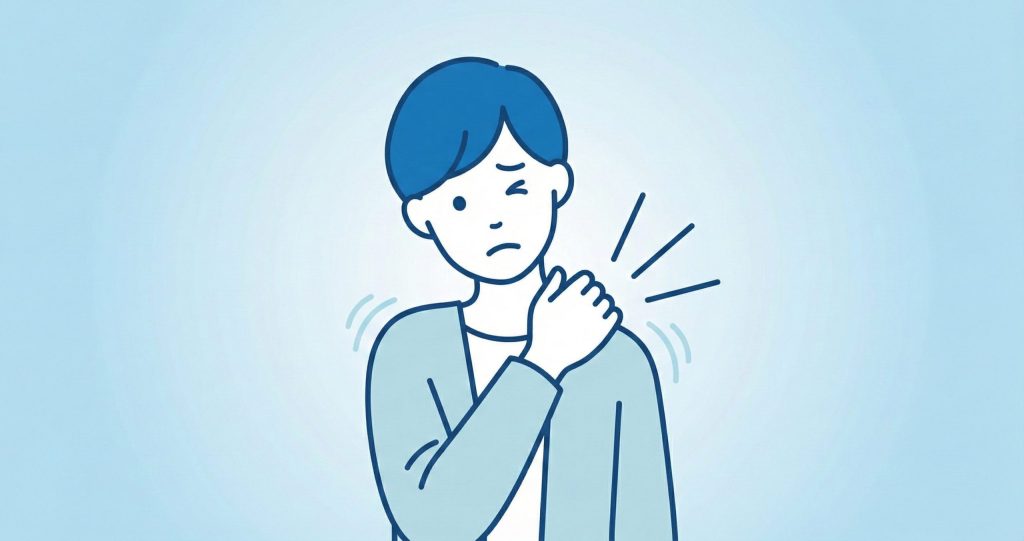 肩の痛みに顔をしかめる男性